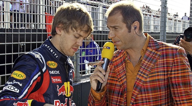 Kai Ebel (rechts) im Gesprch mit Sebastian Vettel im Mrz 2011  | Foto: Jens Bttner (dpa)
