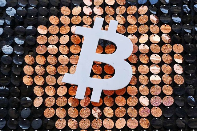 Der Bitcoin ist ein privates, digitale...ich auch als Zahlungsmittel etabliert.  | Foto: NICOLAS TUCAT (AFP)
