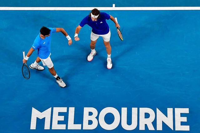 Michail Pervolarakis und Stefanos Tsit...m Montag beginnen die Australian Open.  | Foto: PAUL CROCK (AFP)