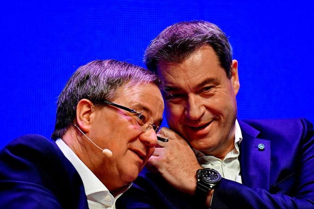 Wer soll als Kanzlerkandidat ins Rennen gegen. Armin Laschet oder Markus Sder?  | Foto: TOBIAS SCHWARZ (AFP)