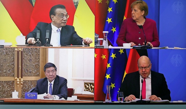 Trafen sich am Bildschirm: Chinas Prem...wicklung und Reform Chinas, He Lifeng.  | Foto: MICHELE TANTUSSI (AFP)