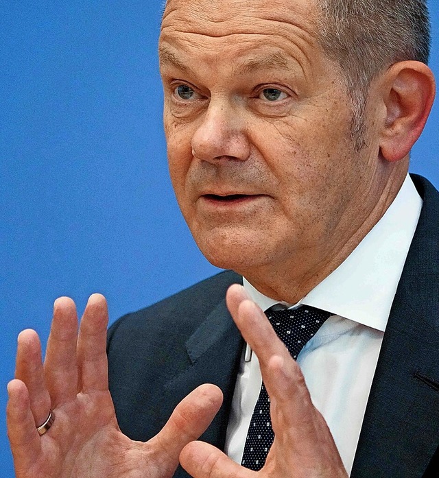 Finanzminister Olaf Scholz sieht einen Aufschwung kommen.  | Foto: MARKUS SCHREIBER (AFP)