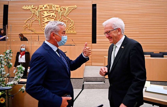 CDU-Vizeregierungschef Thomas Strobl (...Ministerprsident Winfried Kretschmann  | Foto: MARIJAN MURAT (AFP)