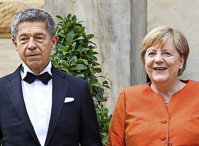 Joachim Sauer und Angela Merkel am Son...bei den Wagner-Festspielen in Bayreuth  | Foto: Daniel Karmann (dpa)