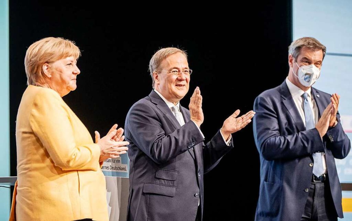 Die selbsternannten &#8222;Stars der U...Merkel, Armin Laschet und Markus Söder  | Foto: Michael Kappeler (dpa)