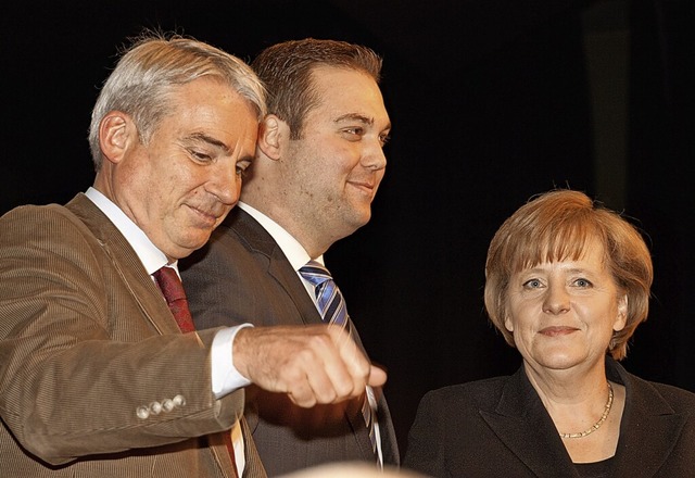 Angela Merkel stand 2011 mit Thomas St...f der Bhne der Waldshuter Stadthalle.  | Foto:  Bernd Glasstetter