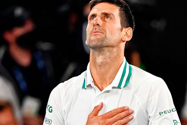 Novak Djokovic nach seinem Sieg bei den Australian Open 2021.  | Foto: PAUL CROCK (AFP)