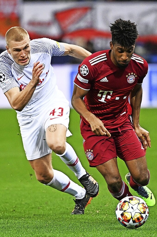 Bayern-Torschtze Kingsley Coman (r.) ...as CL-Achtelfinal-Hinspiel endete 1:1.  | Foto: Sven Hoppe (dpa)