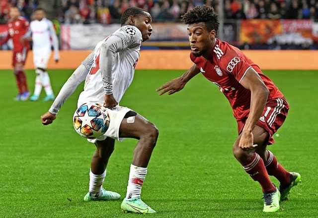 Kingsley Coman (rechts) im Zweikampf mit Mohamed Camara  | Foto: KERSTIN JOENSSON (AFP)