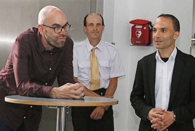 Die Kandidaten Oliver Melzer (sieben S...g im Rathaus Schwanau am Sonntagabend   | Foto: Heidi Fel