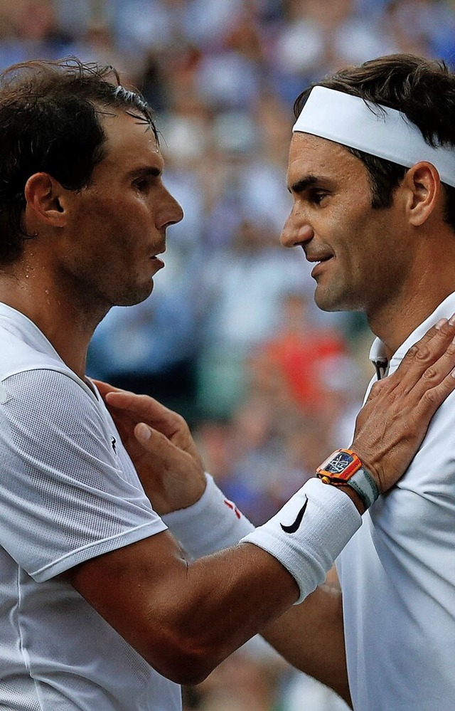 Spielen sie  gemeinsam Doppel? Roger Federer (rechts) und Rafael Nadal  | Foto: ADRIAN DENNIS (AFP)
