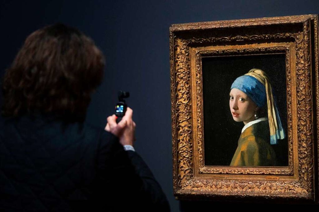 Vermeer brachte die Gegenwart zum Leuc...bekannteste Porträt des Niederländers.  | Foto: Peter Dejong (dpa)
