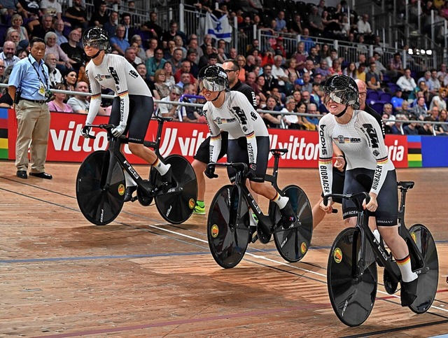 Das deutsche Team auf dem Weg zur Gold-Medaille  | Foto: OLI SCARFF (AFP)