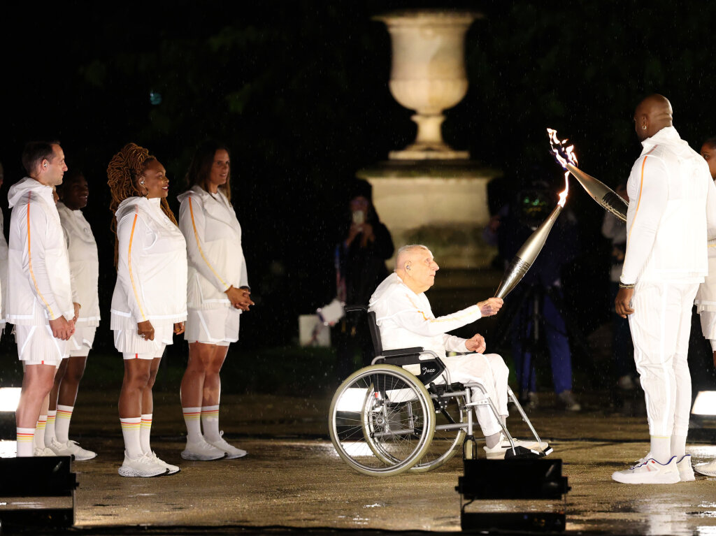 Emotionaler und dramaturgischer Hhepunkt: die Entzndung des olympisches Feuers.