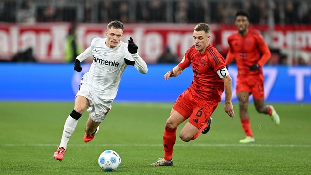 Nationalmannschafts-Kollegen im rasant... Wirtz (l) und Bayerns Joshua Kimmich.  | Foto: Sven Hoppe/dpa