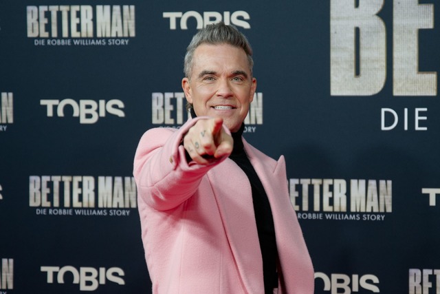 Kommt 2025 mit Konzerten nach Deutschl...uperstar Robbie Williams. (Archivbild)  | Foto: Henning Kaiser/dpa