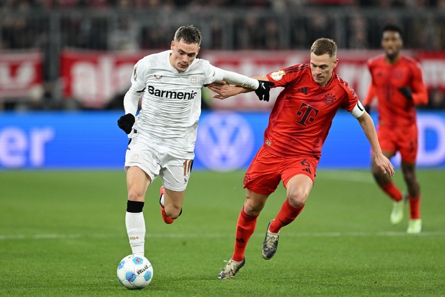 Am Samstag Gegner - irgendwann auch ge... Wirtz (l) und Bayerns Joshua Kimmich.  | Foto: Sven Hoppe/dpa