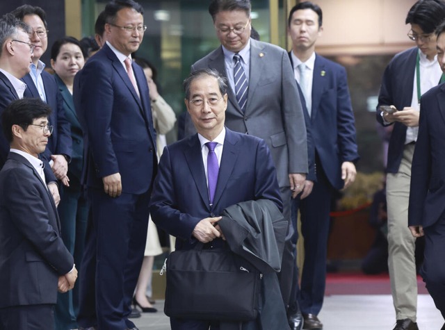 Der sdkoreanische bergangsprsident Han Duck Soo gab seinen Rcktritt bekannt.  | Foto: Hong Hae-in (dpa)